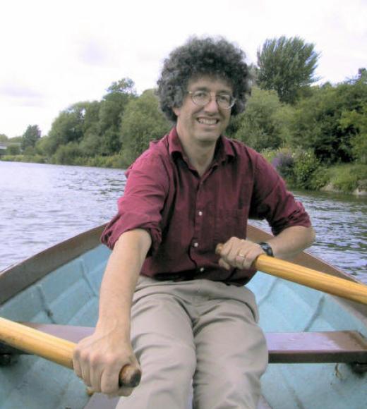 Alan Hastings rowing a boat
